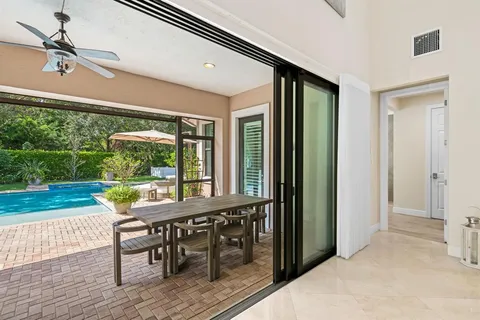 a view of a porch with furniture and yard