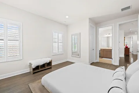 a bedroom with a bed and a couch