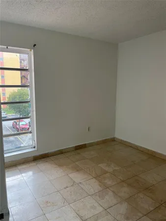 an empty room with window