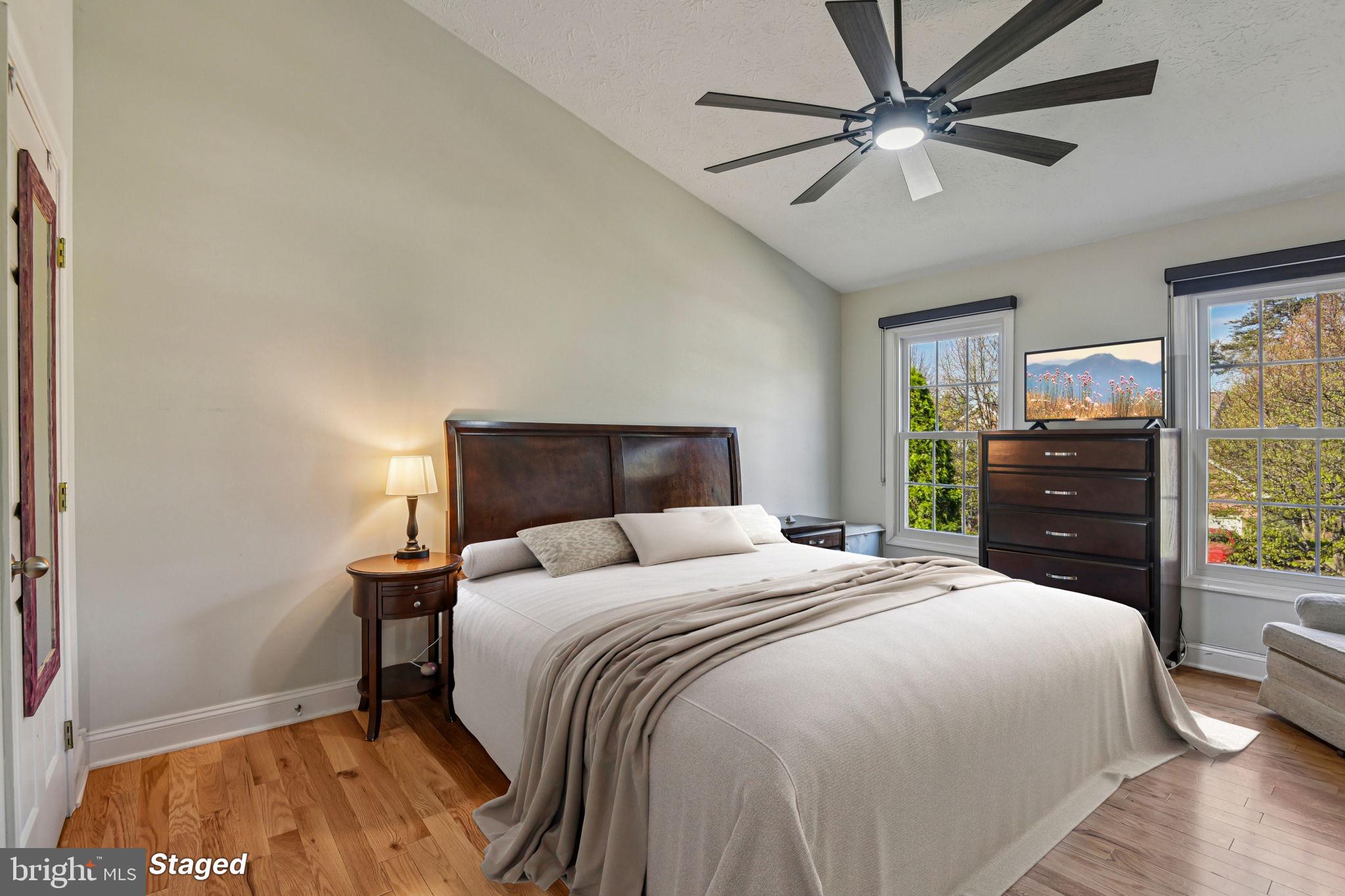 7617 Bear Forest Road Hanover, MD 21076 - Photo 12 of 37 a bedroom with a bed and a chandelier