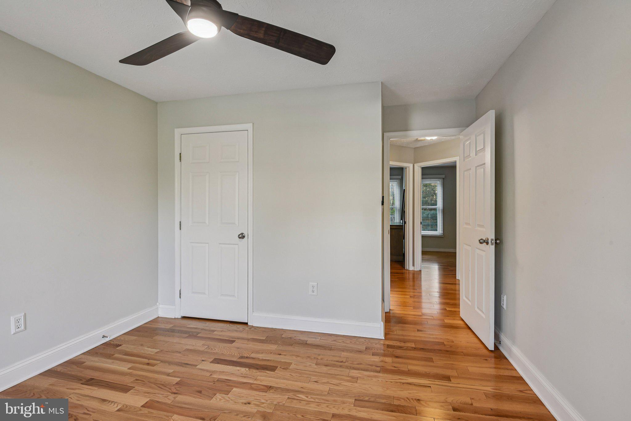 7617 Bear Forest Road Hanover, MD 21076 - Photo 19 of 37 a view of an empty room and wooden floor