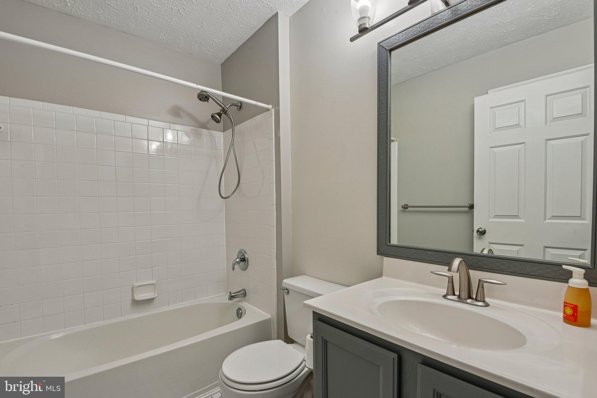 7617 Bear Forest Road Hanover, MD 21076 - Photo 20 of 37 a bathroom with a sink a toilet and shower