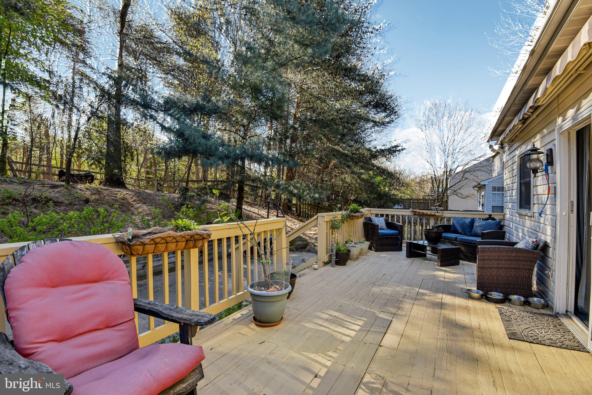 7617 Bear Forest Road Hanover, MD 21076 - Photo 34 of 37 a view of a patio with couches table and chairs and potted plants