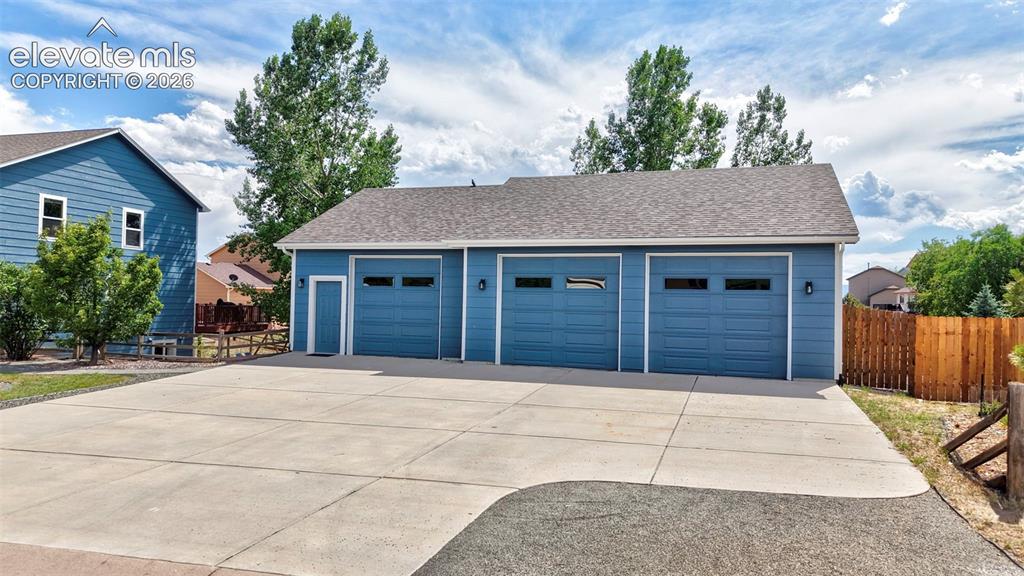 12571 Scamper Road Peyton, CO 80831 - Photo 3 of 49 Detached 3 car with it's own concrete driveway