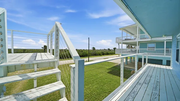 a view of a balcony with chairs