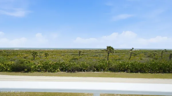 a view of a house with a back yard