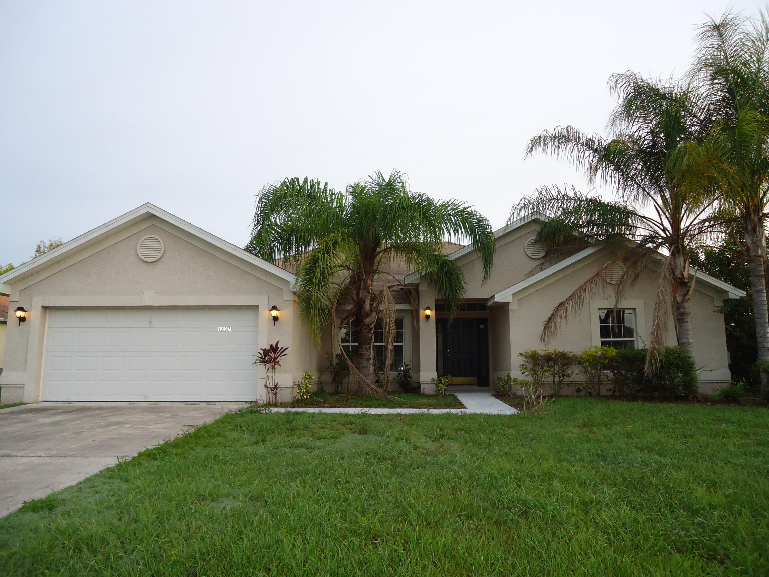 1237 Southwest Fountain Avenue Port St. Lucie, FL 34953 - Photo 1 of 27 FRONT