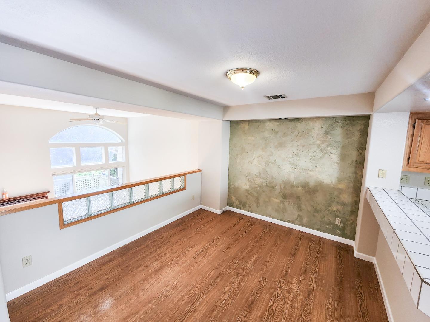 10 Patrick Way Half Moon Bay, CA 94019 - Photo 3 of 11 a view of an empty room with wooden floor and a window