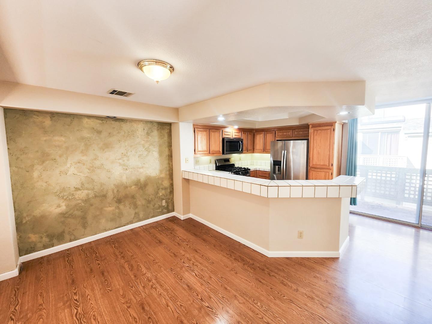 10 Patrick Way Half Moon Bay, CA 94019 - Photo 4 of 11 a view of kitchen with wooden floor and electronic appliances