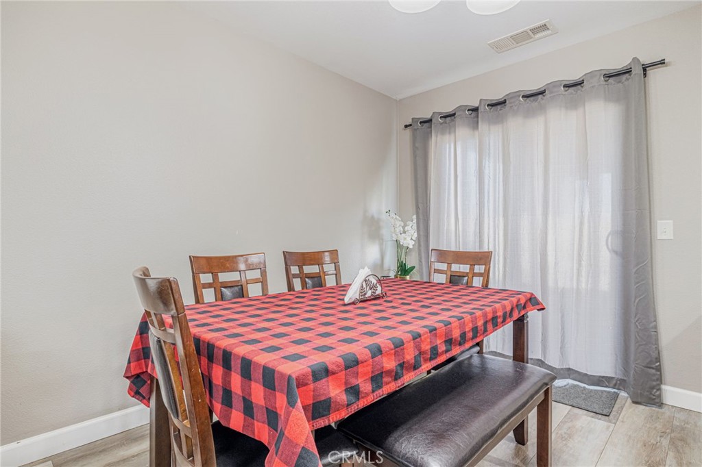 43128 Homestead Street Lancaster, CA 93535 - Photo 16 of 33 a bedroom with a bed and a table in it