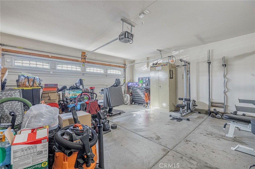 43128 Homestead Street Lancaster, CA 93535 - Photo 18 of 33 a very nice looking room with many windows