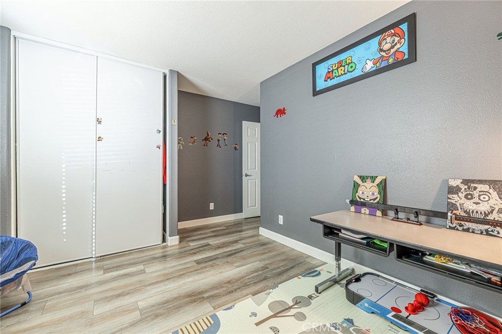 43128 Homestead Street Lancaster, CA 93535 - Photo 20 of 33 a workspace with furniture and rug