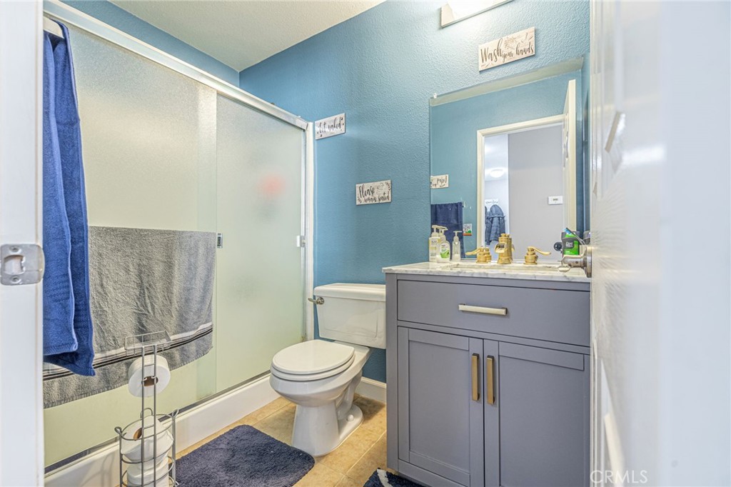 43128 Homestead Street Lancaster, CA 93535 - Photo 24 of 33 a bathroom with a sink a toilet and shower