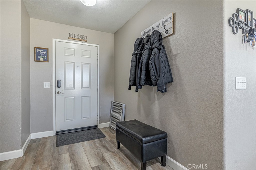 43128 Homestead Street Lancaster, CA 93535 - Photo 31 of 33 a view of walk in closet with clothes and shoes