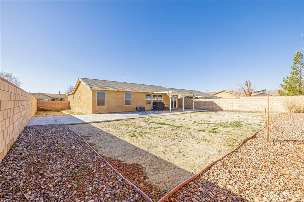 43128 Homestead Street Lancaster, CA 93535 - Photo 8 of 33 a house view with a backyard space