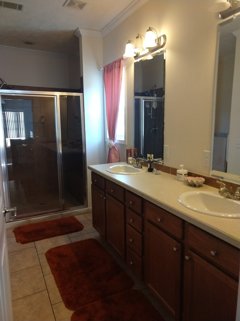 136 Britton Road Windsor, SC 29856 - Photo 11 of 60 a bathroom with double vanity and a mirror
