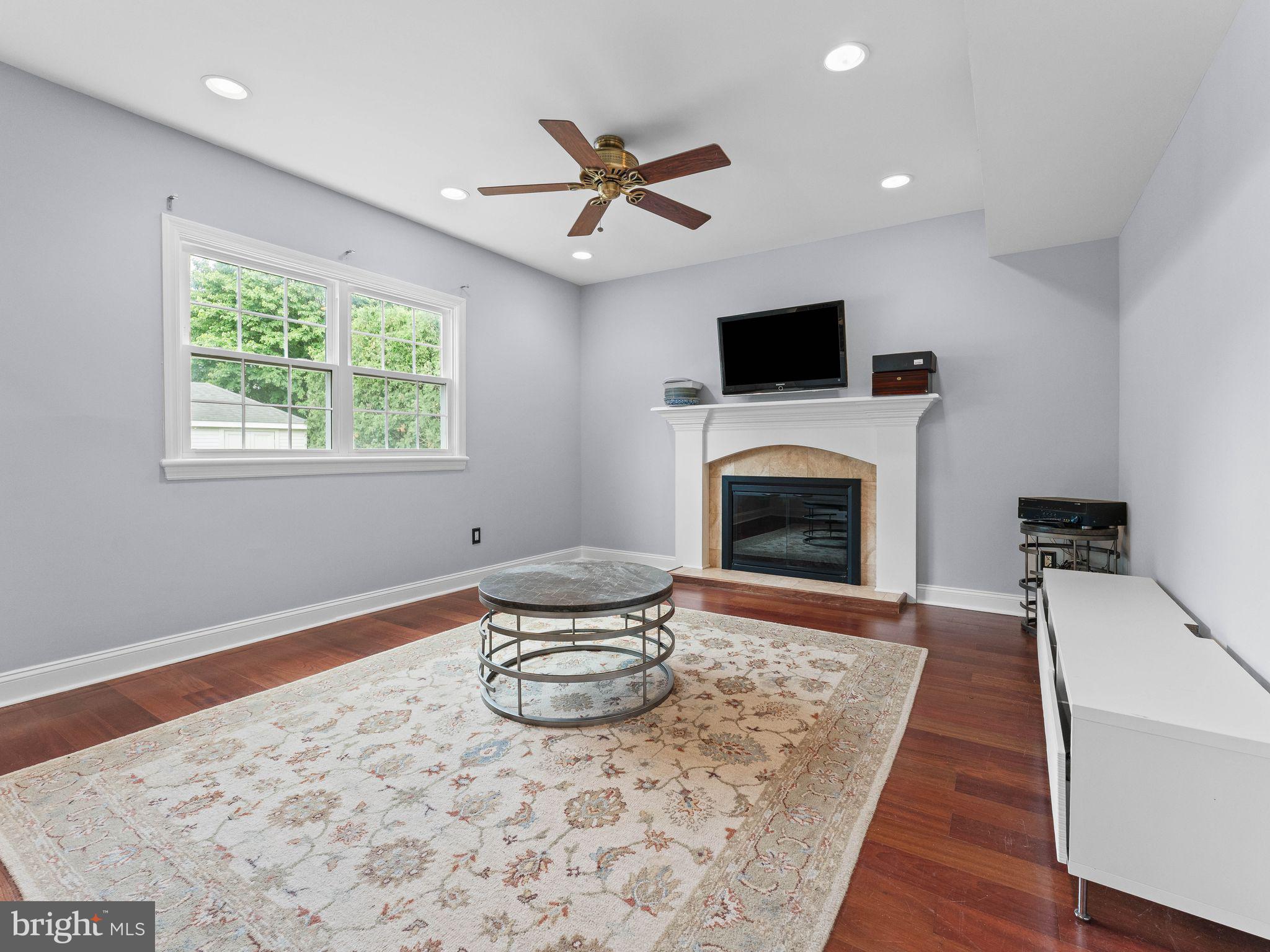8 Chesterfield Road Sewell, NJ 08080 - Photo 17 of 57 a living room with furniture and a fireplace
