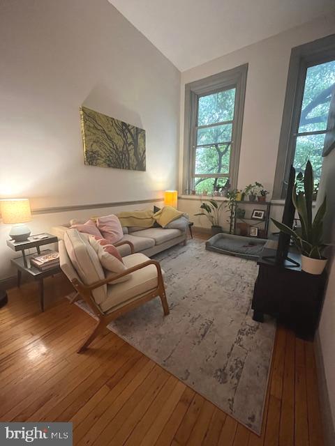 511 South Bond Street, Unit 304 Baltimore, MD 21231 - Photo 3 of 14 a living room with furniture and floor to ceiling windows