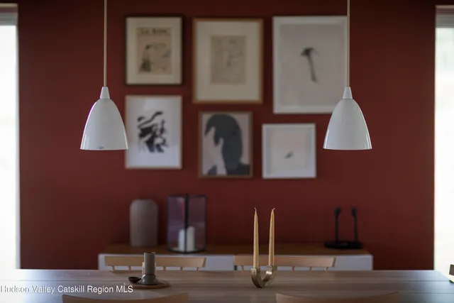 a room with a mirror and a lamp