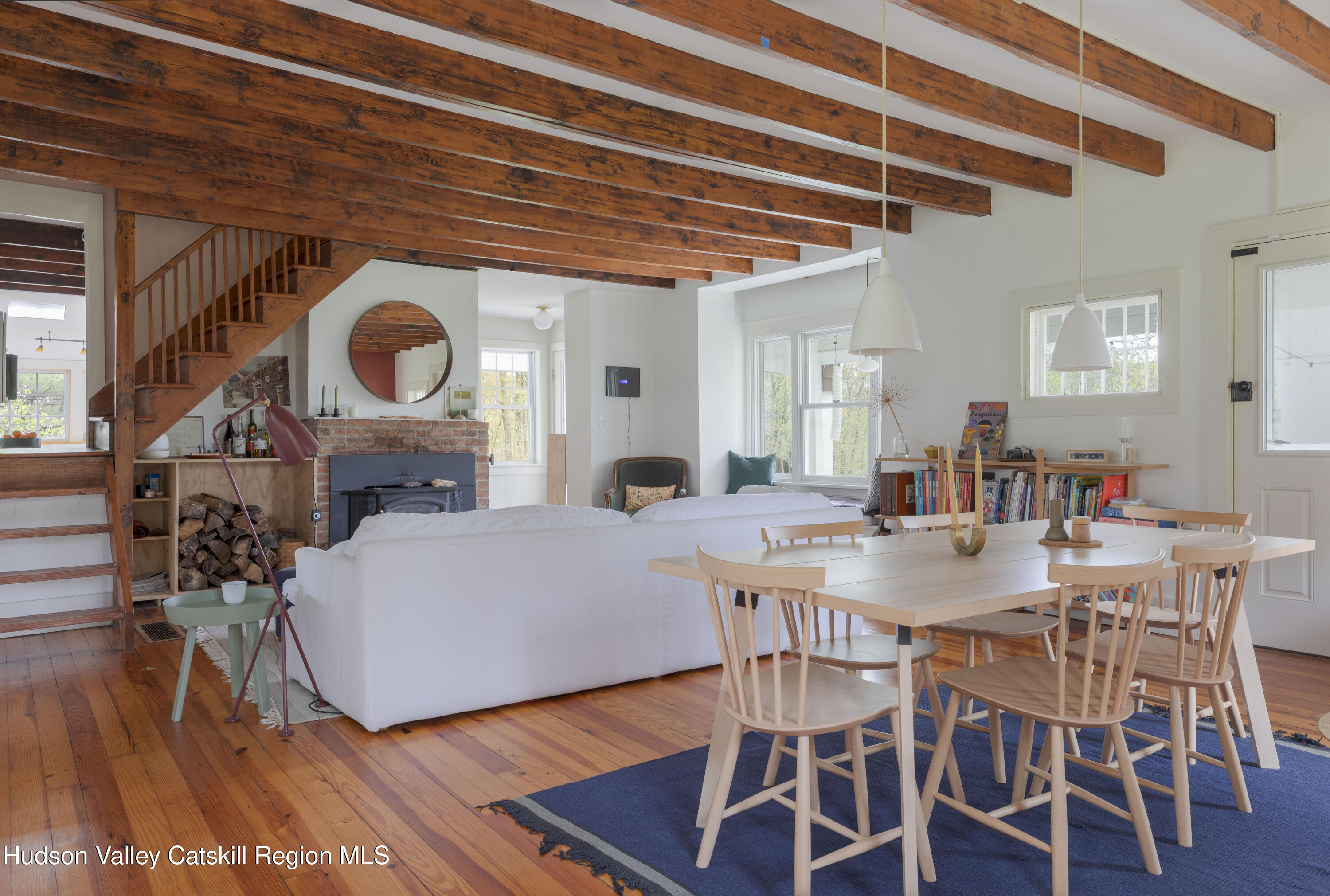 57 Dellenbaugh Road Cragsmoor, NY 12566 - Photo 12 of 26 a view of a dining room with furniture and wooden floor