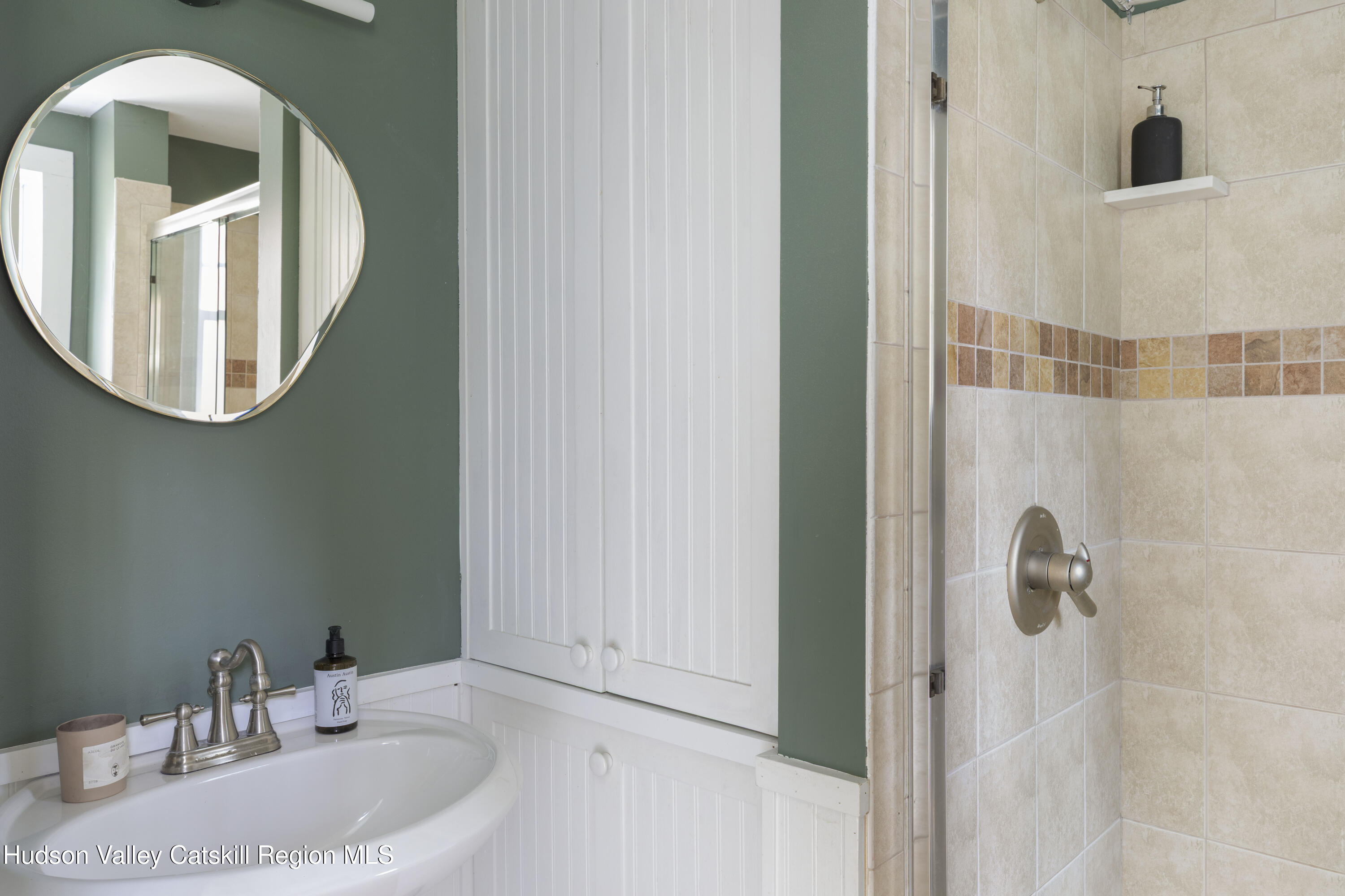 57 Dellenbaugh Road Cragsmoor, NY 12566 - Photo 13 of 26 a bathroom with a sink and a mirror