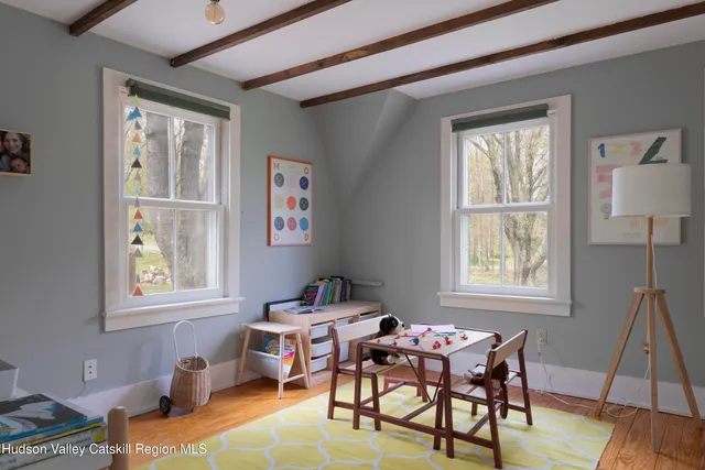 a dining room with furniture and window