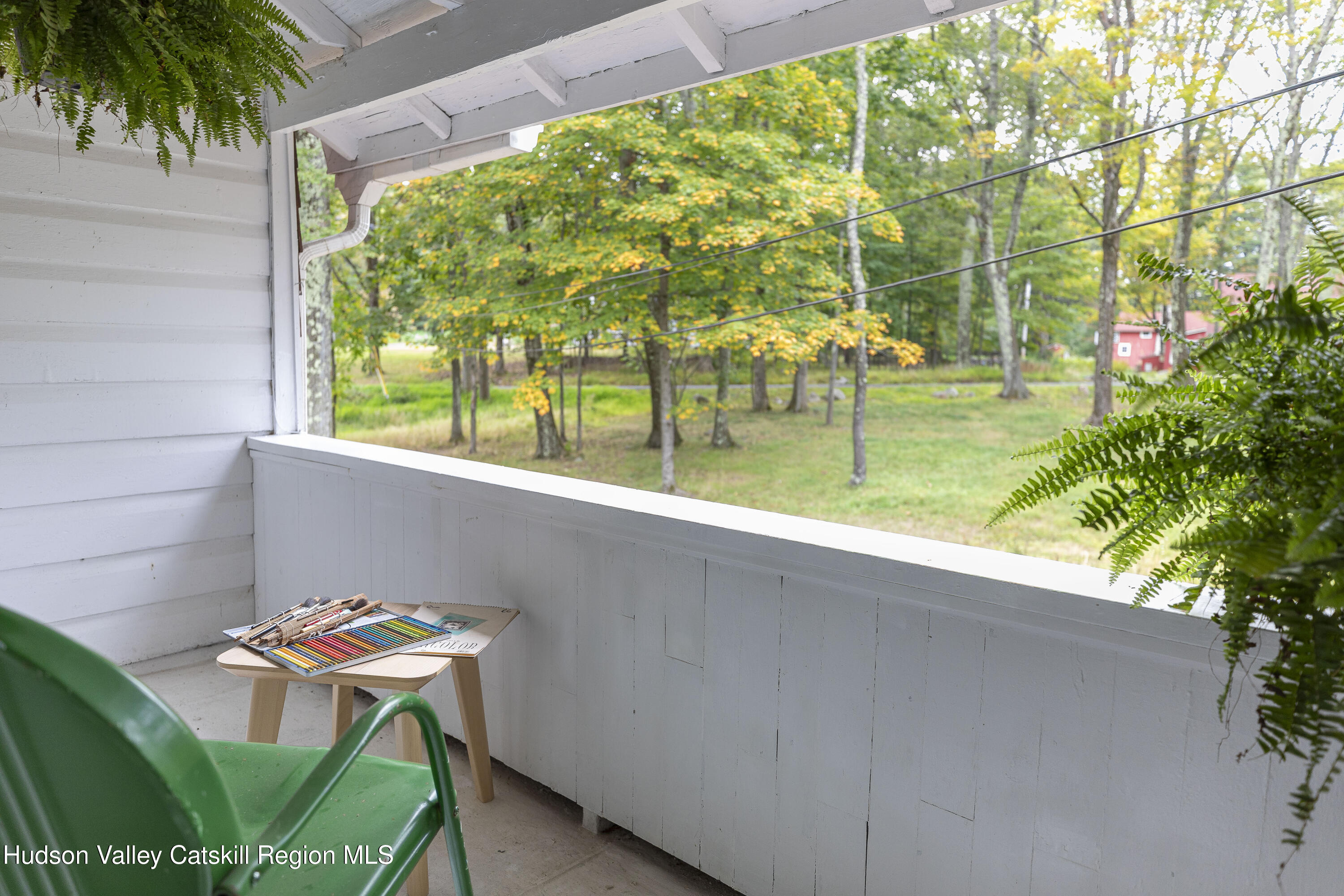 57 Dellenbaugh Road Cragsmoor, NY 12566 - Photo 20 of 26 a backyard of a house with table and chairs