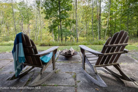 a view of a patio with couple of chairs