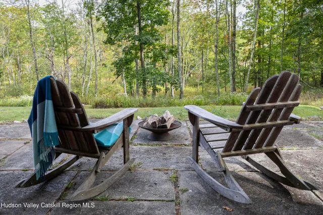 a view of a patio with couple of chairs
