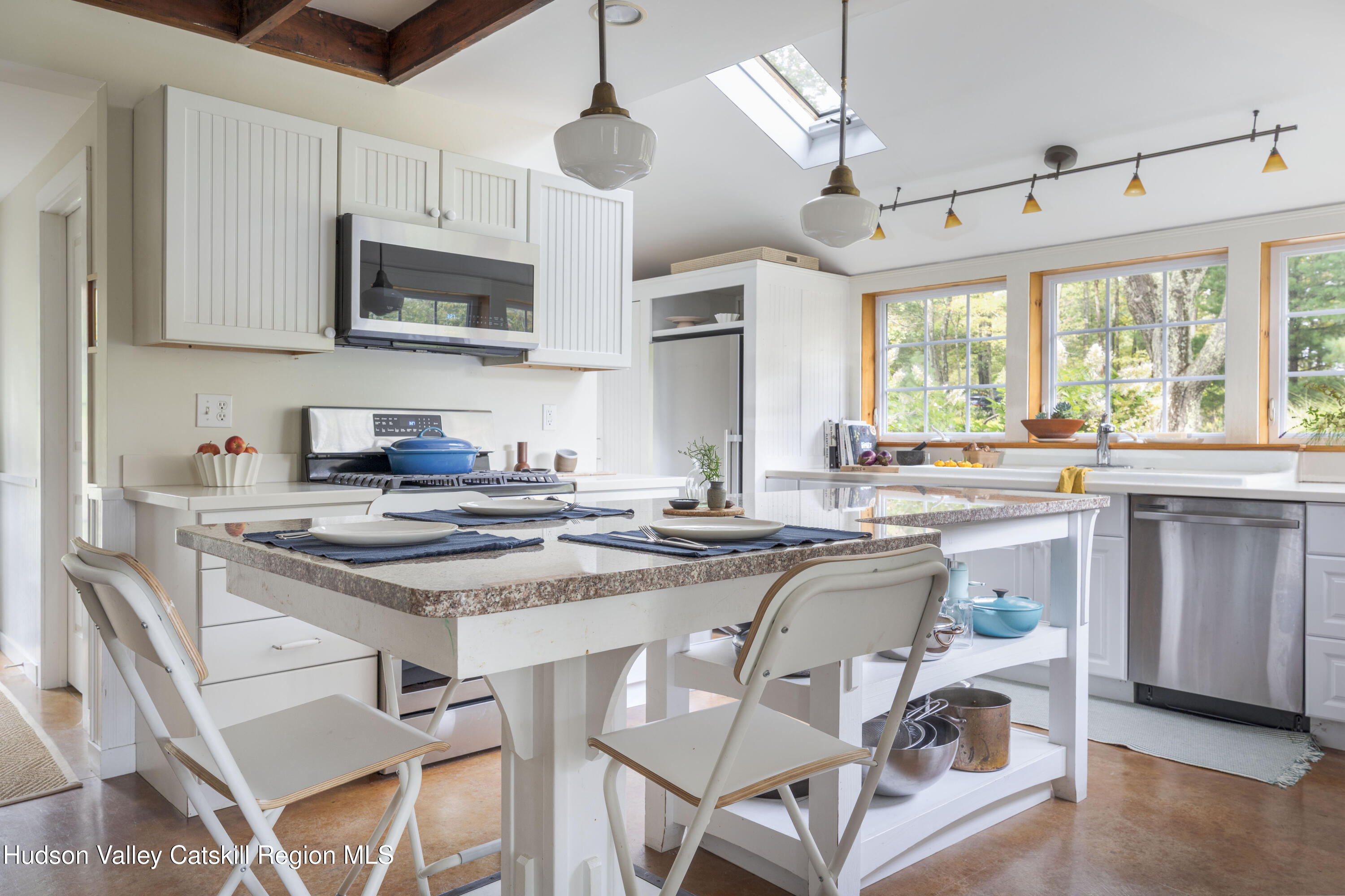 57 Dellenbaugh Road Cragsmoor, NY 12566 - Photo 5 of 26 a kitchen with stainless steel appliances granite countertop a stove a sink and a microwave