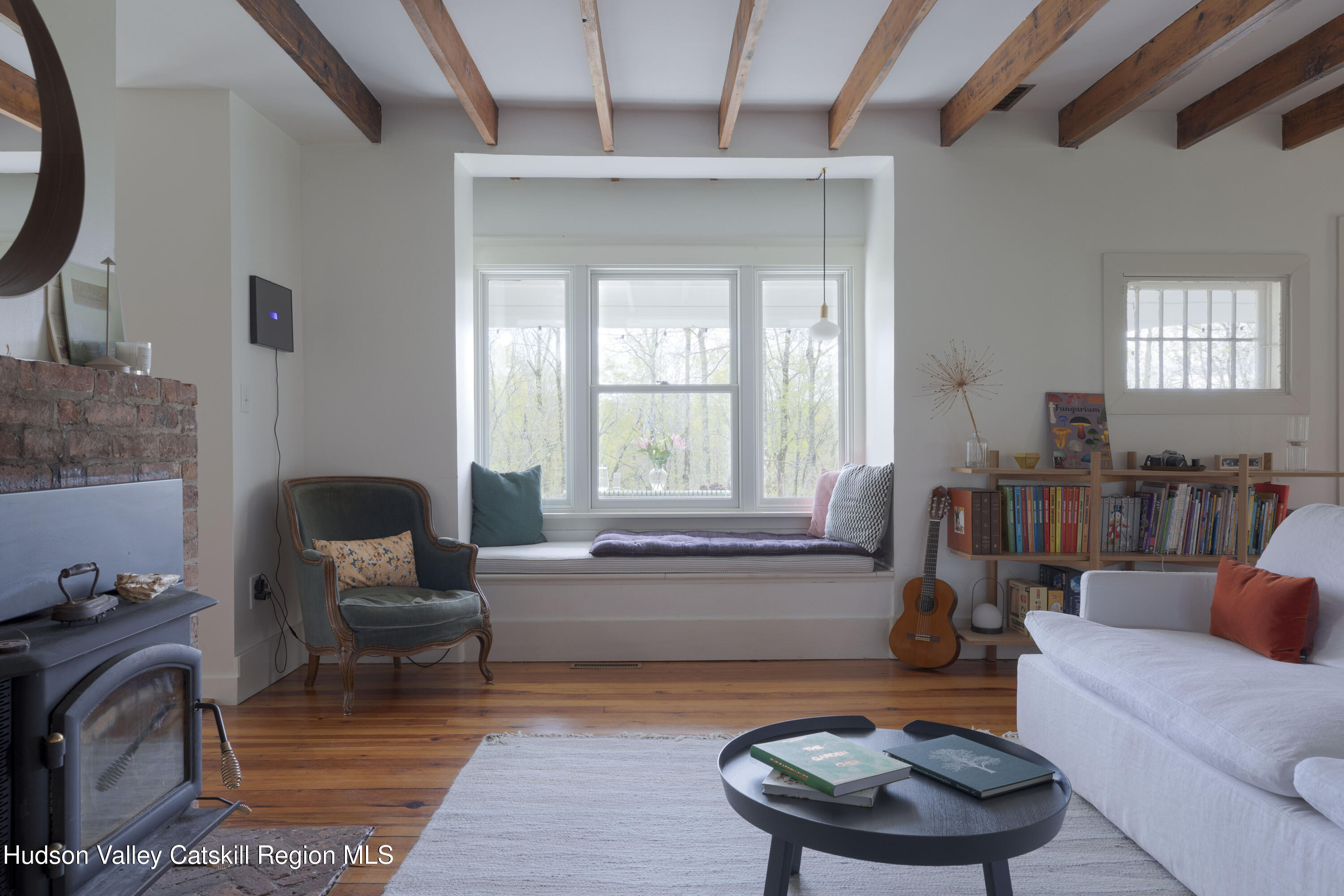 57 Dellenbaugh Road Cragsmoor, NY 12566 - Photo 10 of 26 a living room with furniture and a large window