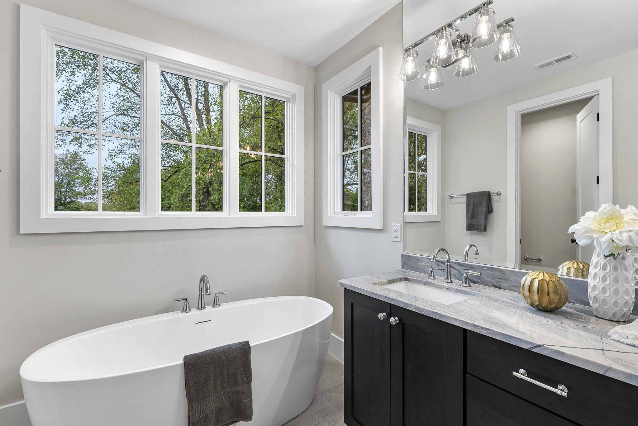 2312 Airline Drive Raleigh, NC 27607 - Photo 34 of 54 a bathroom with a sink double vanity and a mirror