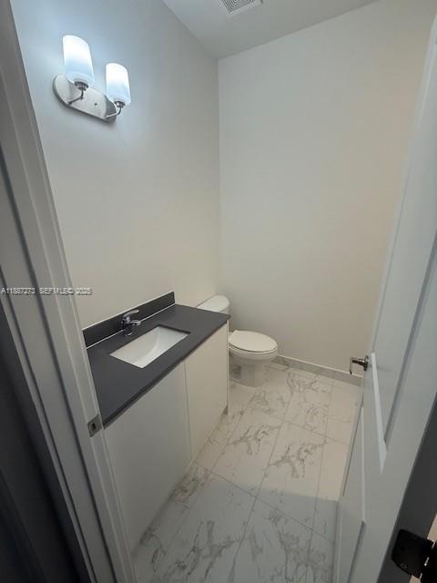 18944 Southwest 344th Terrace Homestead, FL 33034 - Photo 13 of 17 a bathroom with a sink and a toilet
