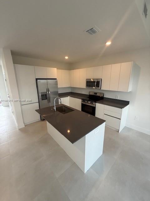 18944 Southwest 344th Terrace Homestead, FL 33034 - Photo 7 of 17 a kitchen with kitchen island cabinets and wooden floor