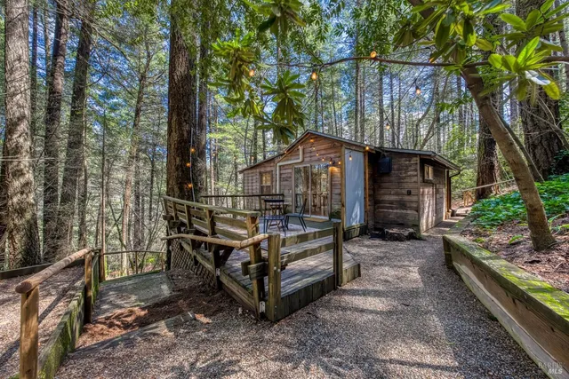 a view of a dining room with furniture wooden floor and chandelier