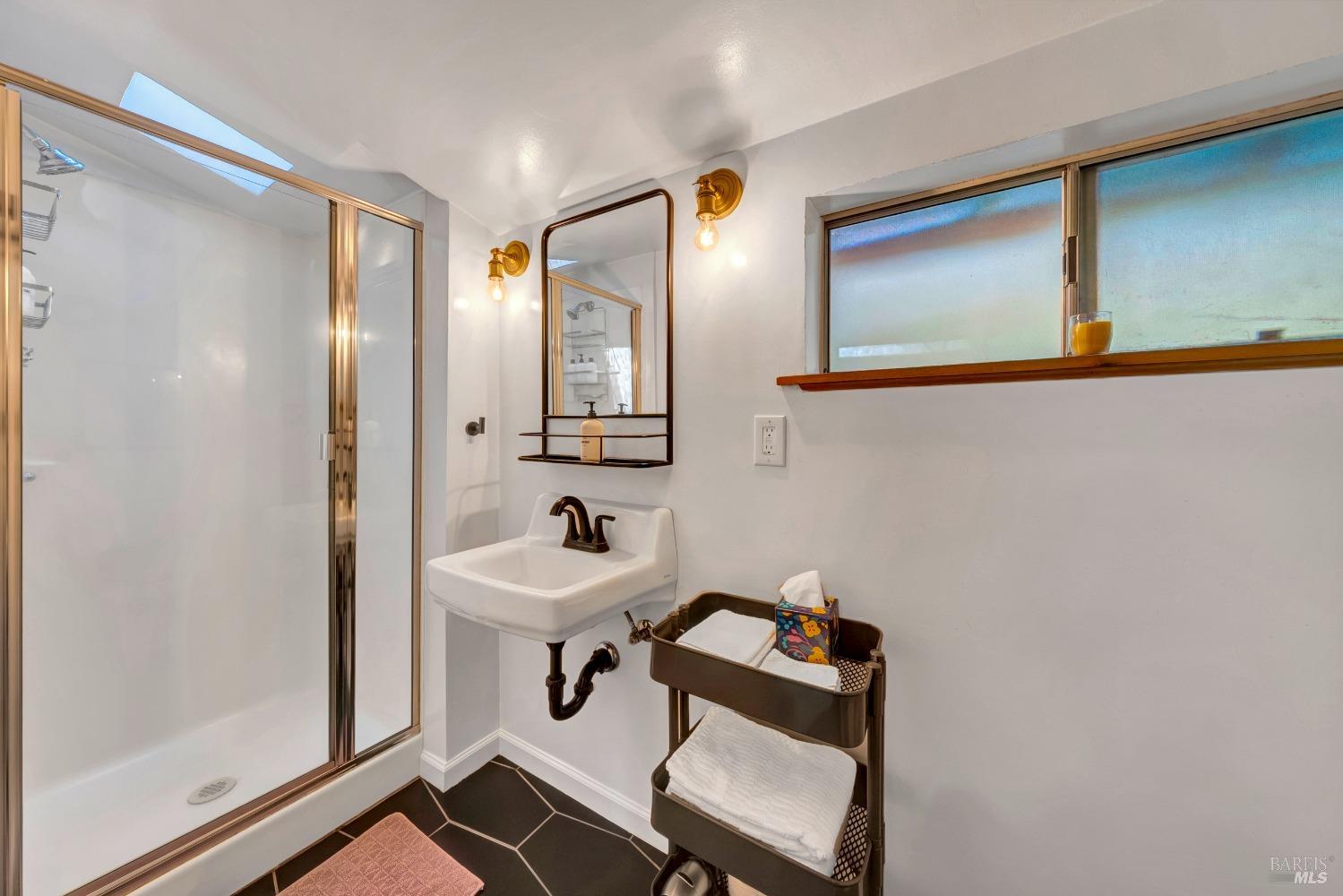 17000 Edgewood Way Middletown, CA 95461 - Photo 30 of 40 a bathroom with a sink mirror and vanity