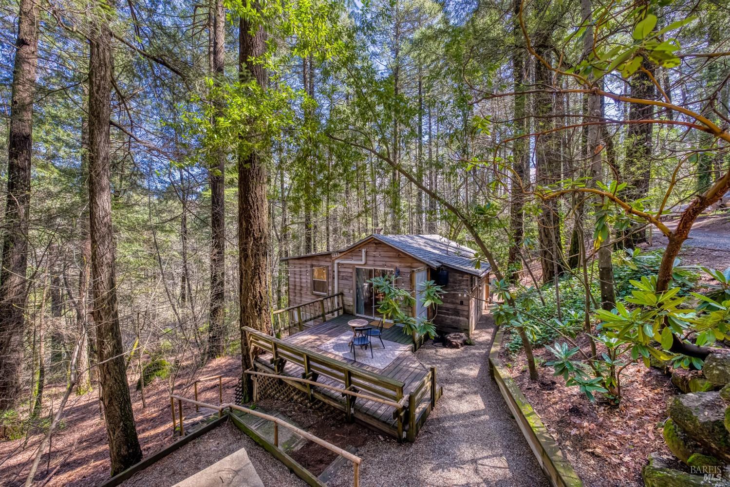 17000 Edgewood Way Middletown, CA 95461 - Photo 3 of 40 a view of a patio with table and chairs and potted plants