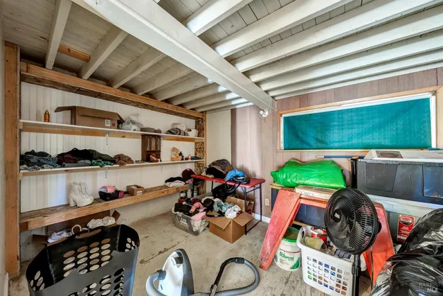 a view of a small house with a yard