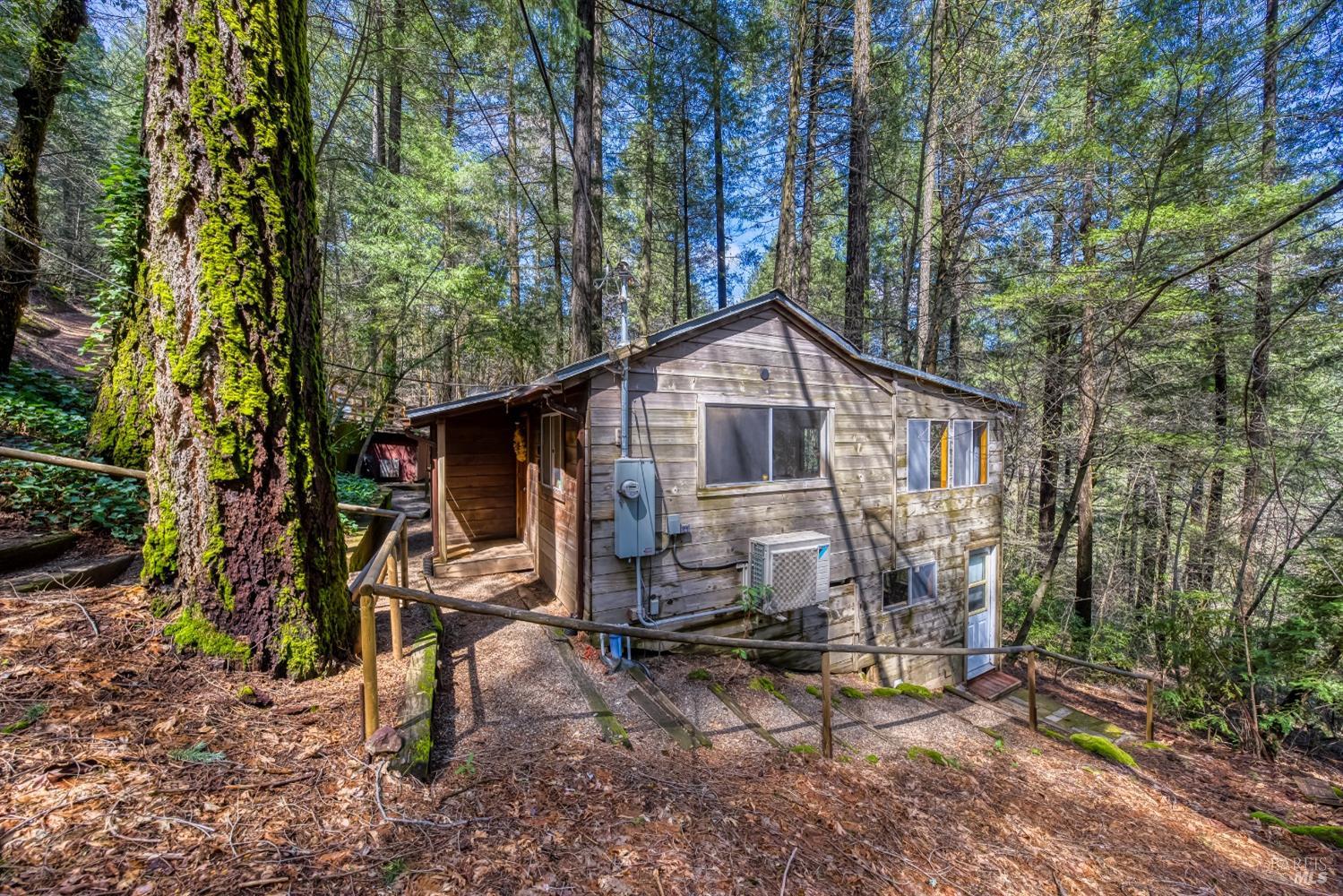 17000 Edgewood Way Middletown, CA 95461 - Photo 36 of 40 a view of a small house with a yard