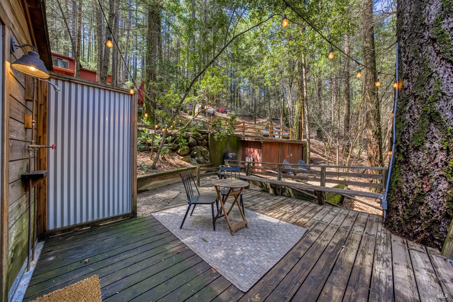 17000 Edgewood Way Middletown, CA 95461 - Photo 10 of 40 a view of a patio with table and chairs and wooden floor