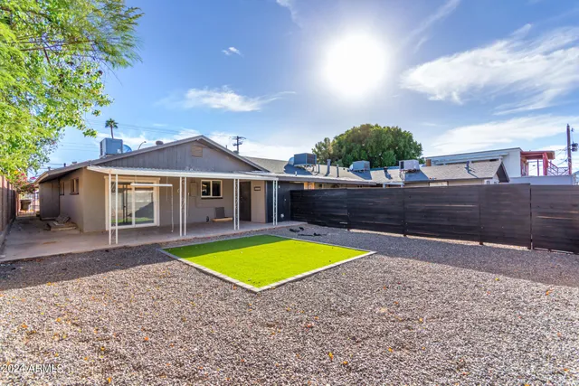 a view of a house with a swimming pool and porch