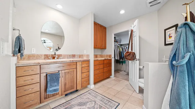 a bathroom with a sink a vanity and a mirror