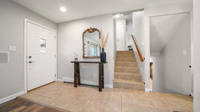 a view of entryway with stairs and wooden floor