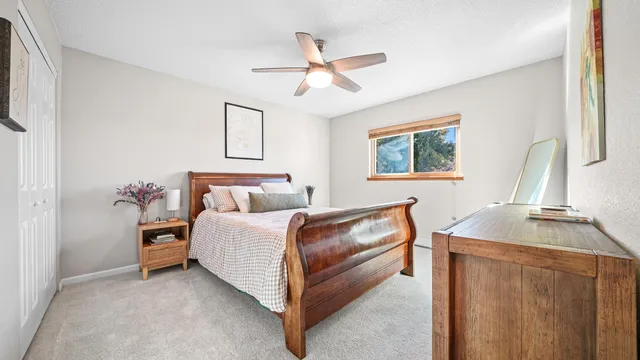 a bed room with a bed and a chandelier