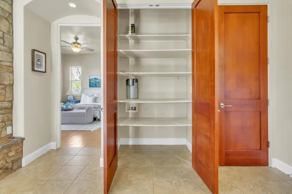 a kitchen with stainless steel appliances granite countertop a refrigerator and a stove