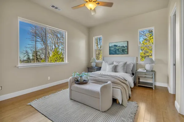 a bed room with a bed and a window