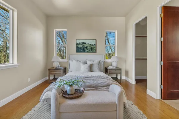 a bedroom with a bed and a dresser