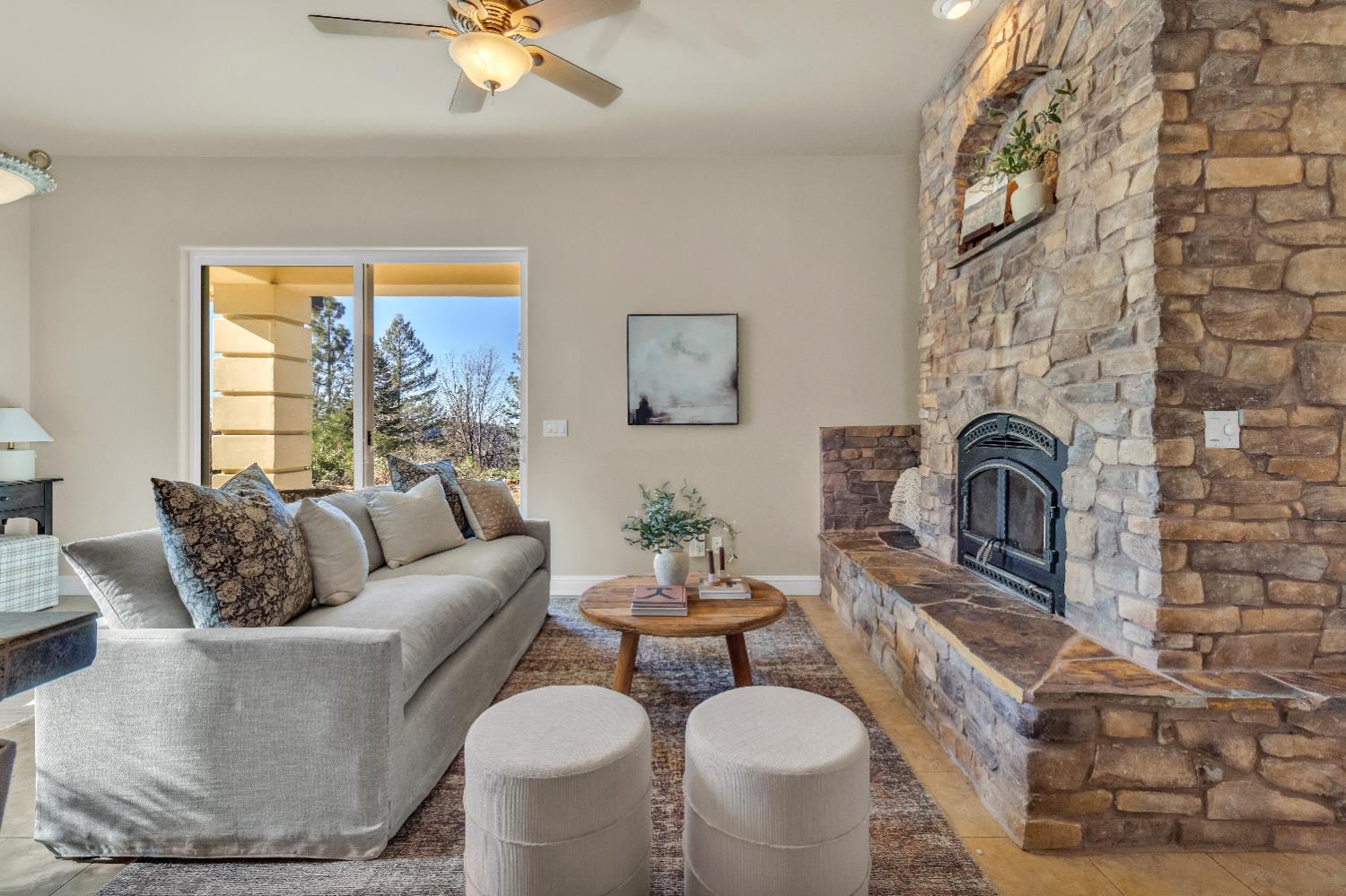 34275 Canyon View Court Alta, CA 95701 - Photo 3 of 35 a living room with furniture a fireplace and a table
