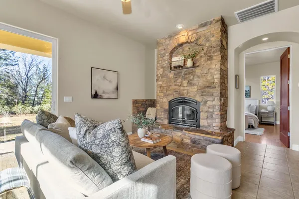 a living room with furniture and a fireplace