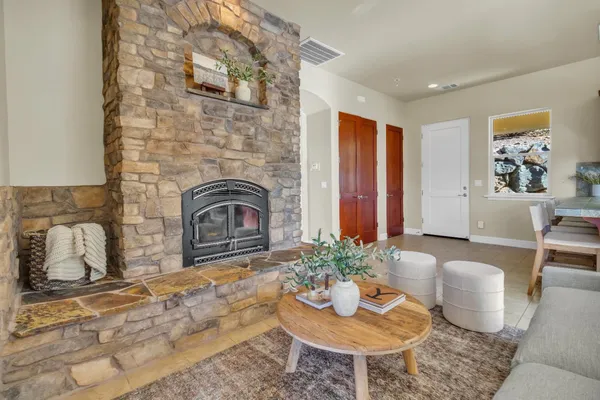 a living room with furniture and a fireplace